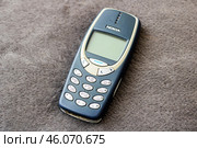Belarus, Minsk - 11.01.2025: A Nokia cell phone is currently laying on a soft carpet surface. Редакционное фото, фотограф Аксенова Вера / Фотобанк Лори