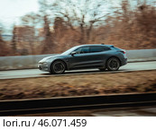 Zeekr 001 high-end electric vehicle driving down country road. Редакционное фото, фотограф Константин Григорьев / Фотобанк Лори