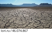 Cracked desert land with tumbleweed. Water problems, global warming, drought, water shortage in the world, health problems, poverty and misery in countries. Climate change: from friendship to green grove. Стоковое AI-видео, аниматор ALLA YURTAYEVA / Фотобанк Лори