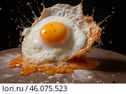 Fried egg splashing on griddle with seasoning and oil. Стоковое AI-изображение, AI-художник Иван Рябоконь / Фотобанк Лори