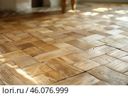 Sunlight illuminating intricate herringbone parquet wood flooring. Стоковое AI-изображение, AI-художник Иван Рябоконь / Фотобанк Лори