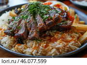 Sizzling grilled steak resting on fluffy rice with french fries and herbs. Стоковое AI-изображение, AI-художник Иван Рябоконь / Фотобанк Лори