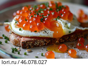 Delicious toast with salmon, fried egg, and salmon roe dripping yolk for refined breakfast. Стоковое AI-изображение, AI-художник Иван Рябоконь / Фотобанк Лори