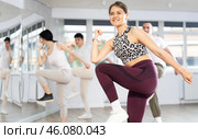 Girl with team of young like-minded people learn to dance modern dances. Стоковое фото, фотограф Яков Филимонов / Фотобанк Лори