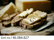 Slice of wholemeal bread with butter curl. Buttering toast. Yellow butter scattered on a piece of bread. Bread with toasting and spreading butter. Generous spread of butter on a rustic bread slice. Стоковое AI-изображение, AI-художник Марина Демидюк / Фотобанк Лори