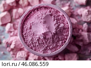 A bowl filled with pink powder, with lumps and particles of the substance scattered around. The texture of the powder looks loose and airy, with small lumps that create a feeling of natural and soft material. The color is rich, pink, which makes the scene visually pleasing and delicate. The background is blurred, but supports the main color palette, creating a harmonious image. Стоковое AI-изображение, AI-художник Анна Кривицкая / Фотобанк Лори