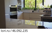 Kitchen with a white counter and a coffee maker. Стоковое AI-видео, аниматор Sergey Grishin / Фотобанк Лори