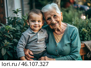 A happy family, a child and a grandmother hug on the street in the park, happy and contented. A grandmother who hugs her grandson, showing love. Стоковое AI-изображение, AI-художник Photojuli / Фотобанк Лори