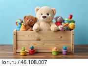 Wooden box with children's toys. A container with a teddy bear and educational wooden toys on a light blue background. Стоковое AI-изображение, AI-художник Photojuli / Фотобанк Лори
