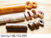 Homemade fruit rolls on a wooden board, candy pastilles for a healthy breakfast concept. Стоковое фото, фотограф Кутина Татьяна / Фотобанк Лори