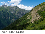 View of Mount Semenov-Bashi of the Greater Caucasus Range from the upper station of the cable car of the Dombai ski resort on a summer day, Karachay-Cherkessia, Russia. Стоковое фото, фотограф Ula Ulachka / Фотобанк Лори