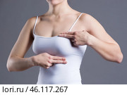 Breast test, woman examining her breasts for cancer, heart attack, pain in human body. Стоковое фото, фотограф Станислав Тарко / Фотобанк Лори