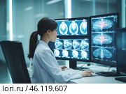 Female Asian neurologist analyzes brain scans using dual desktop monitors in a modern medical office setting. Стоковое AI-изображение, AI-художник Sergey Grishin / Фотобанк Лори