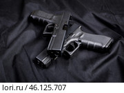 handgun on black background. Стоковое фото, фотограф Сергей Толмачёв / Фотобанк Лори