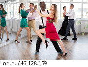Man and young woman practicing waltz in dancing studio. Стоковое фото, фотограф Яков Филимонов / Фотобанк Лори