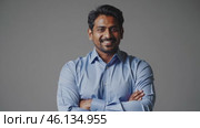 Confident Indian Professional Smiling with Folded Arms. Стоковое видео, видеограф Данил Руденко / Фотобанк Лори