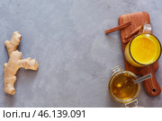Golden milk in a transparent glass cup. Curcumin, anise, cinnamon. covid-19 protection. The concept of health and longevity. Стоковое фото, фотограф Кутина Татьяна / Фотобанк Лори