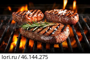 Grilled meat on grill. Coals are on fire. For barbecue. Three chops. AI illustration. Стоковое AI-изображение, AI-художник Катерина Ковалева / Фотобанк Лори