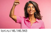Middle aged latin american woman with raised fist of empowerment, strength and women solidarity, International Womens Day concept. Стоковое AI-изображение, AI-художник Анастасия Золотницкая / Фотобанк Лори