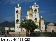 Bar, Montenegro 07.20.24: The Church of St. Jovan Vladimir is a Serbian Orthodox Church, located in the city center, near the coastline. A majestic snow-white building with gilded domes and bells. (2024 год). Редакционное фото, фотограф Юлия Петровская / Фотобанк Лори