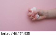 Taba paw pink and white colorful anti-stress toys squirt on baby's hand. Стоковое видео, видеограф Терехова Марина / Фотобанк Лори