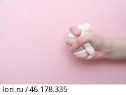 Taba paw pink and white colorful anti-stress toys squirt on baby's hand. Стоковое фото, фотограф Терехова Марина / Фотобанк Лори