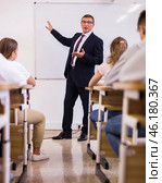 Male teacher lecturing to students at classroom. Стоковое фото, фотограф Яков Филимонов / Фотобанк Лори