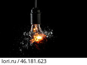 Breaking of light bulb on dark background. Стоковое фото, фотограф Pixel_shot / Фотобанк Лори