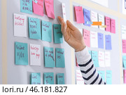 Young woman near scrum task board in office. Стоковое фото, фотограф Pixel_shot / Фотобанк Лори