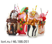 Different delicious freak shakes on white background. Стоковое фото, фотограф Pixel_shot / Фотобанк Лори