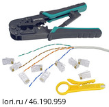 Инструмент для обжима интернет-кабеля витой пары на белом фоне. Tool for crimping of internet cable on a white background. Стоковое фото, фотограф Татьяна Д / Фотобанк Лори