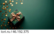 The concept of Defender of the Fatherland Day on February 23. Gift camouflage box with a festive satin ribbon bow on a dark green background. Стоковое AI-изображение, AI-художник Photojuli / Фотобанк Лори