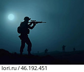 Silhouettes of military soldiers maneuver through thick fog, preparing for an active confrontation. Atmosphere is tense as the sun begins to rise. The military goes on the night attack. Generative AI. Стоковое AI-изображение, AI-художник Юлия Петровская / Фотобанк Лори