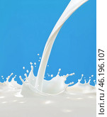 Milk pouring into milk liquid surface. White splash. AI generated illustration. Стоковое AI-изображение, AI-художник Катерина Ковалева / Фотобанк Лори
