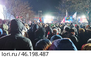 Sremska Mitrovica, Serbia 15.02.2025: Speech by Aleksandar Vucic, Serbian statesman and politician, President of the Republic of Serbia. Supporters gathered at rally, waving flags and chanting slogans. Редакционное фото, фотограф Юлия Петровская / Фотобанк Лори