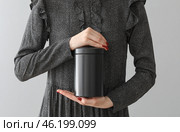 Woman with mortuary urn on light background. Стоковое фото, фотограф Pixel_shot / Фотобанк Лори