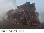 Старый работающий паровоз Л-1344 (серия Л, Лебедянка) крупным планом туманным октябрьским утром. Сортавала. Редакционное фото, фотограф Виктор Карасев / Фотобанк Лори