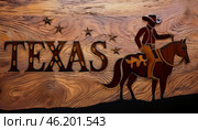 Rustic wooden background, Texas inscription, cowboy on horseback, iconic western image, craftsmanship, emphasizes heritage, captures quintessential Texas ruggedness, celebrates American frontier ethos. Стоковое AI-изображение, AI-художник Андрей Ка / Фотобанк Лори