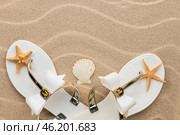Beach fashion, white flip-flops and starfish standing in the sand beach. Стоковое фото, фотограф Александр Собко / Фотобанк Лори