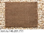 Frame made of burlap with the line lies on  pumpkin seeds. Стоковое фото, фотограф Александр Собко / Фотобанк Лори