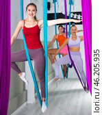 Women making antigravity yoga exercises in stretching twine. Стоковое фото, фотограф Яков Филимонов / Фотобанк Лори