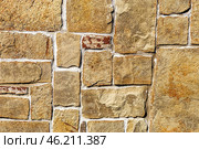 The texture of natural stone Sandstone. The material of natural origin is used for cladding facades of walls, fences and paths in construction. Стоковое фото, фотограф Руслан Хисматов / Фотобанк Лори