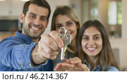 Homeowners. Happy young Indian family spouses standing outside holding car house flat apartment keys, celebrating new purchase buying real estate. Mortgage loan. New home. Mother, father and child. Стоковое AI-видео, аниматор Марина Демидюк / Фотобанк Лори