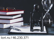 Document and stamp of notary public on table. Стоковое фото, фотограф Pixel_shot / Фотобанк Лори