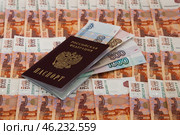 Денежный фон из пятитысячных купюр, купюры 50, 100, 500 и 1000 рублей, российский паспорт / A monetary fund of five thousand banknotes, 50, 100, 500 and 1000 rubles, a Russian passport. Стоковое фото, фотограф Петроченко Мария Петровна / Фотобанк Лори
