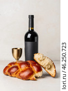 Traditional challah bread with wine on white background. Shabbat Shalom. Стоковое фото, фотограф Pixel_shot / Фотобанк Лори