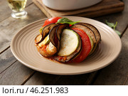 Plate of tasty Ratatouille on wooden background. Стоковое фото, фотограф Pixel_shot / Фотобанк Лори