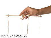 Hand of puppeteer on white background. Стоковое фото, фотограф Pixel_shot / Фотобанк Лори
