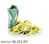 Fresh zucchini spaghetti with spiral grater isolated on white. Стоковое фото, фотограф Pixel_shot / Фотобанк Лори