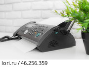 Fax machine, office equipment on white table. Стоковое фото, фотограф Сергей Толмачёв / Фотобанк Лори